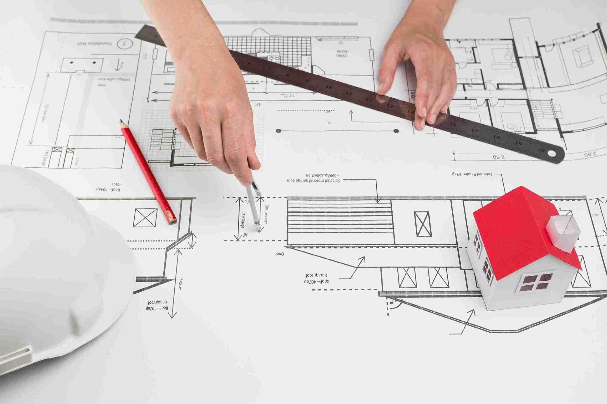 close-up-hand-drawing-blueprint-office_11zon