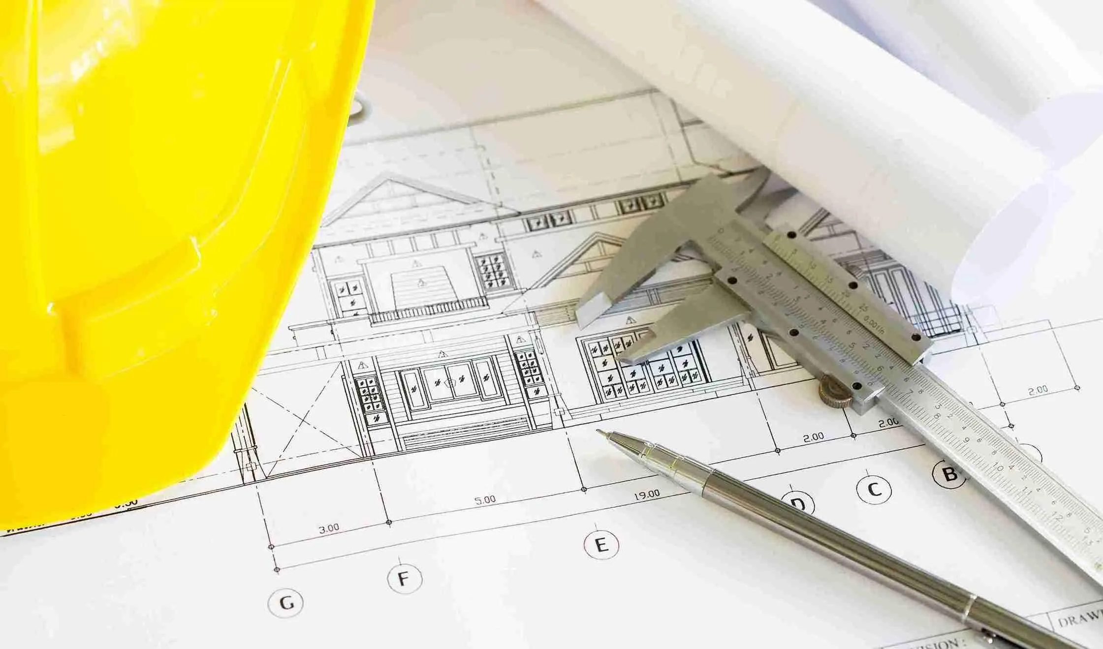 construction-plans-with-yellow-helmet-drawing-tools-bluep_11zon